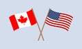 US and Canada crossed flags on stick. American and Canadian national symbols. Vector illustration